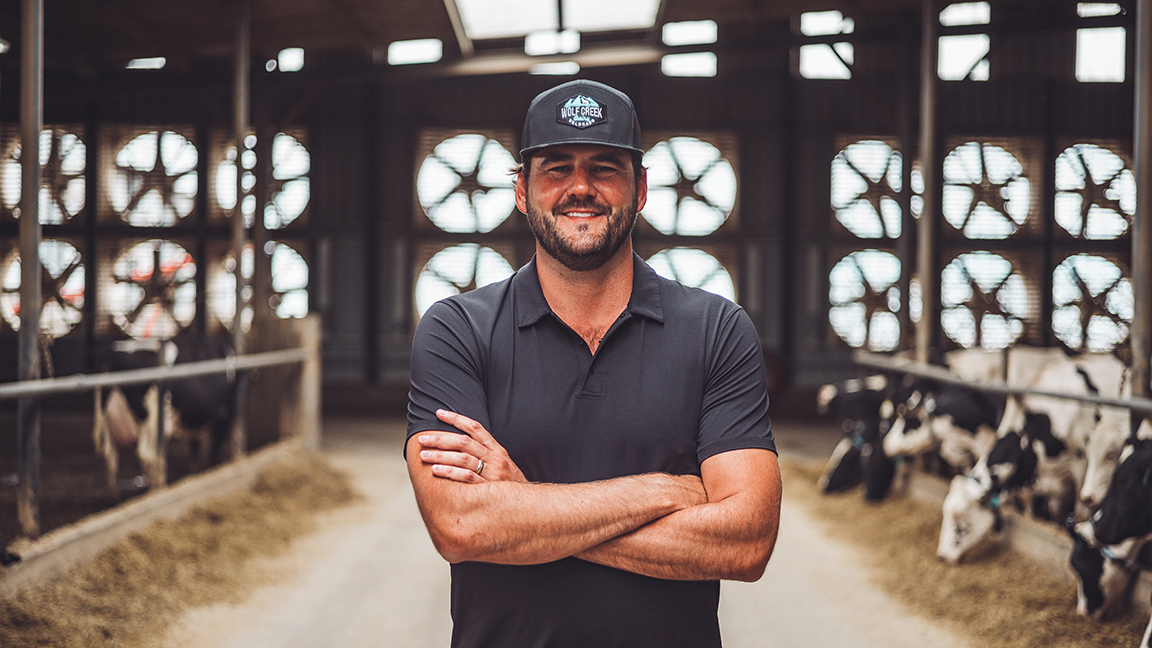 Adrian Diepersloot in the feed lane of the free stall barn.