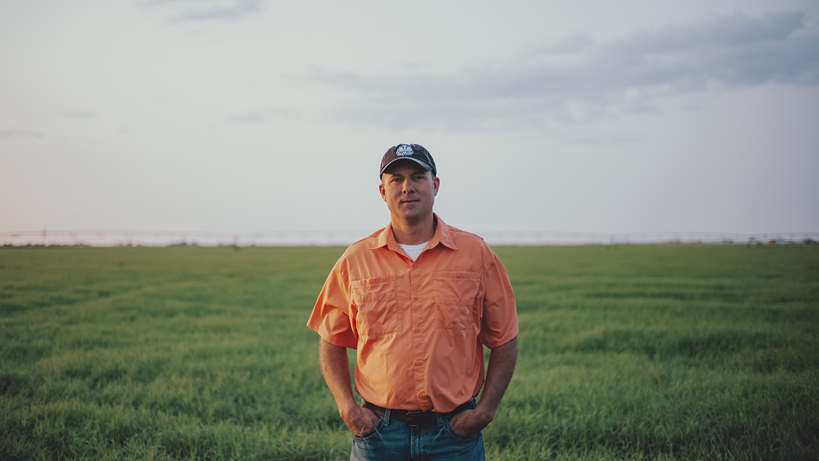 Michael Lawrence in the fields at Caprock Dairy.