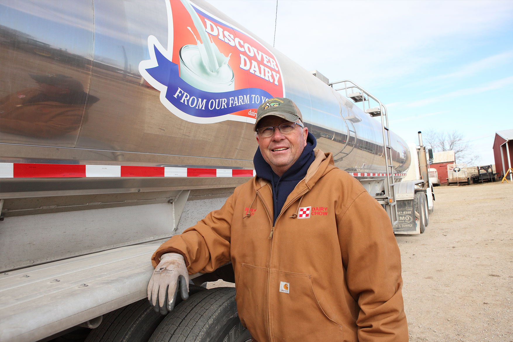 Scott posing with a milk truck.