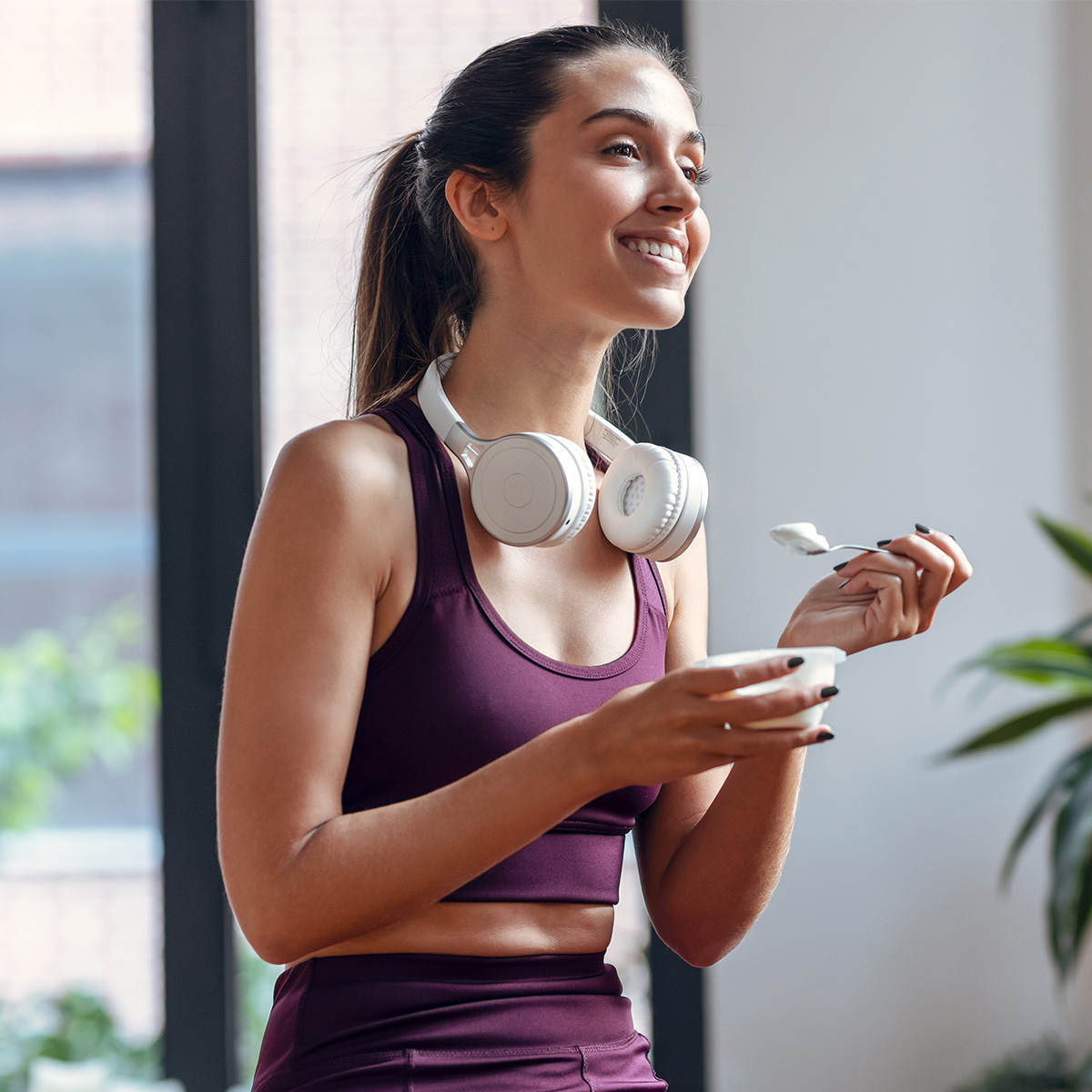 Woman eating yogurt