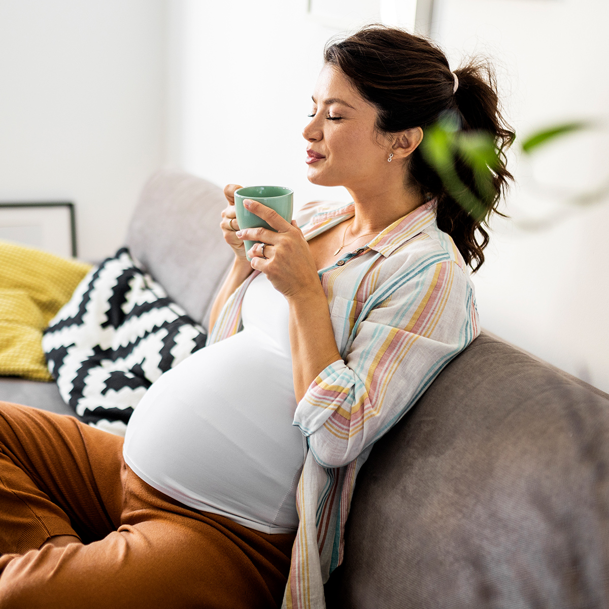 Pregnant woman drinking tea