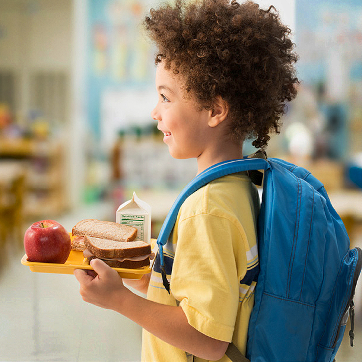 Child with lunch tray