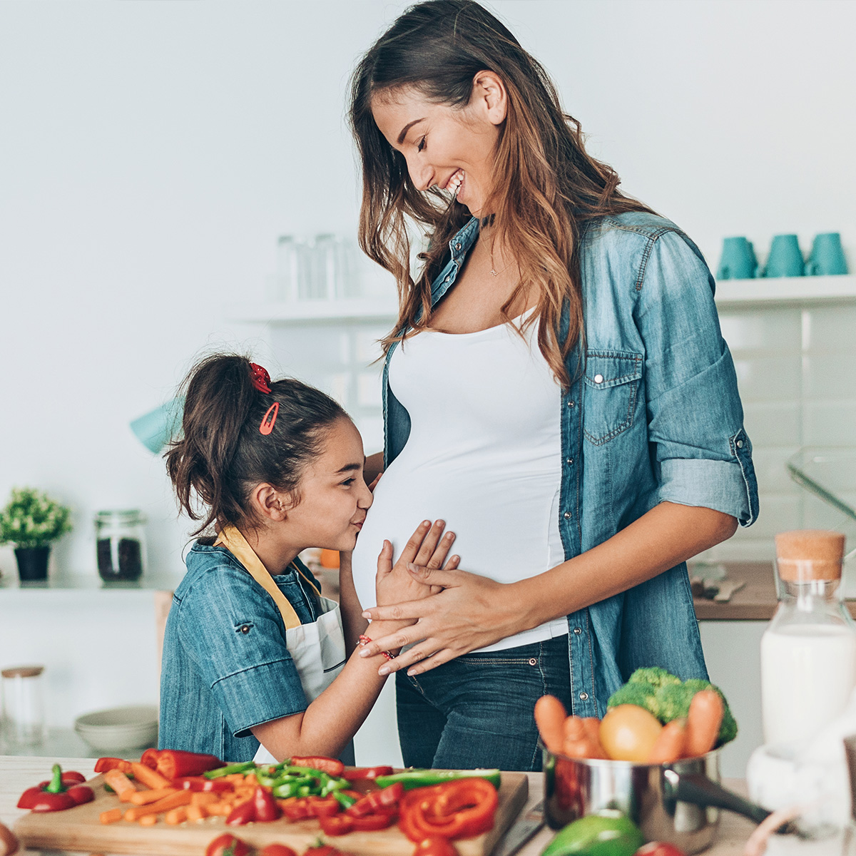 Mother and daughter preparing food