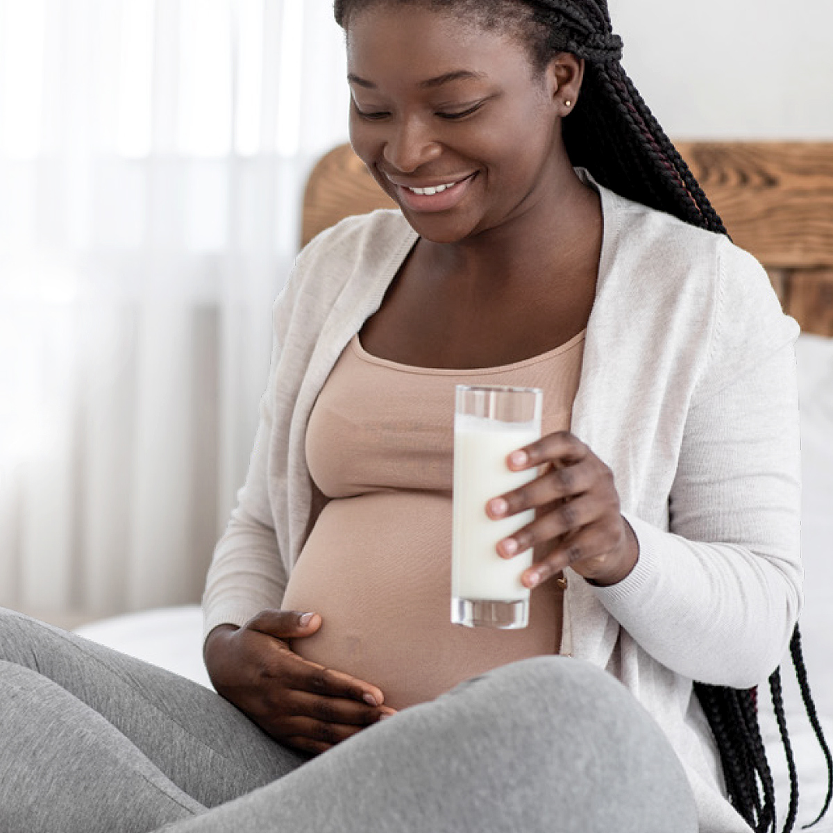 Pregnant woman drinking milk