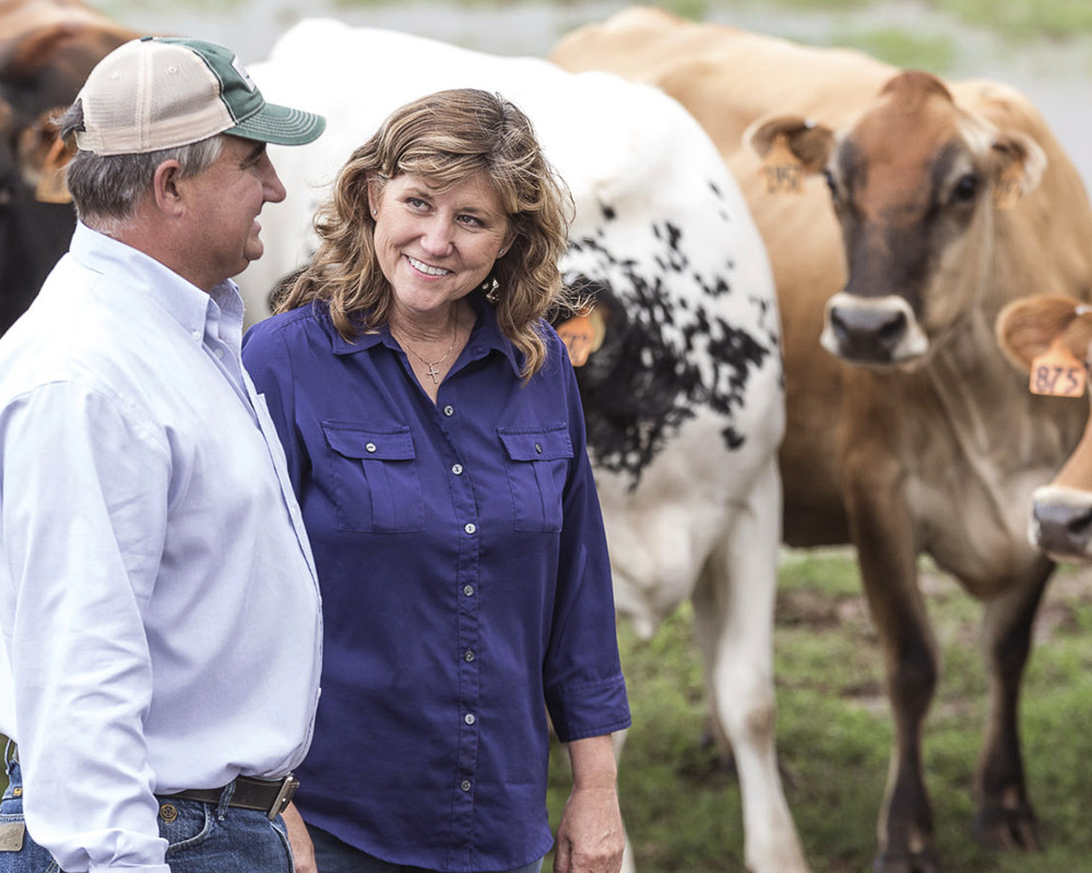 David and Jodi Jackson take a walk with their herd.