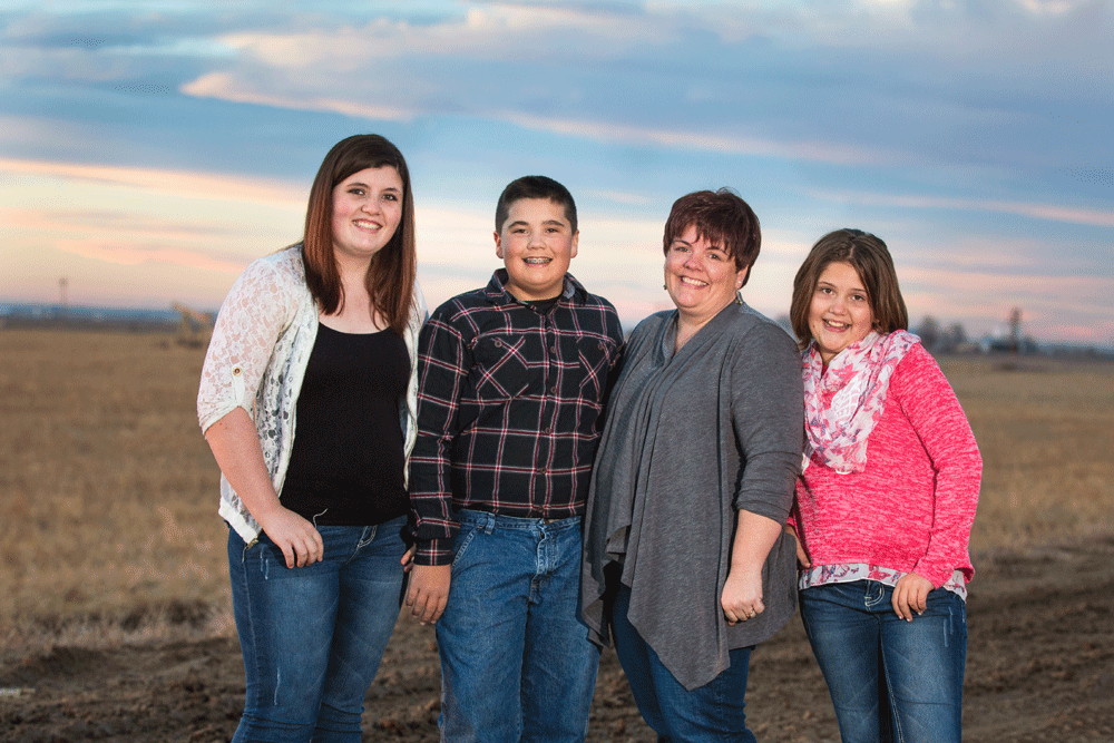 Tammie, Brooke, Sierra and Hunter Eldred pose for a photograph at sunset.