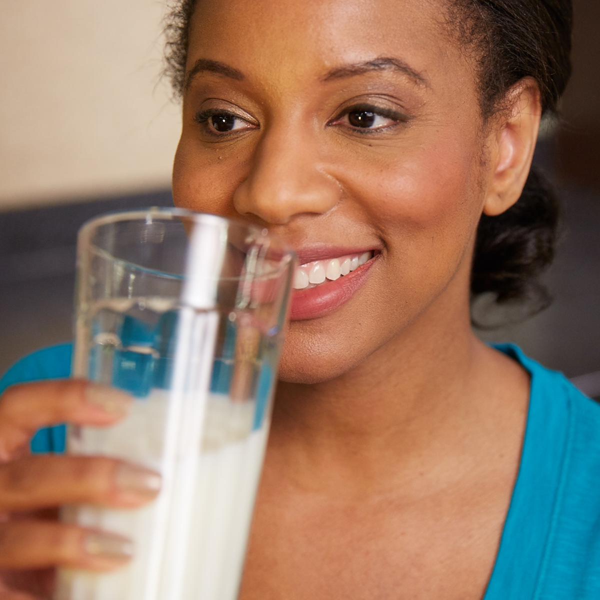 Woman drinking a glass of milk