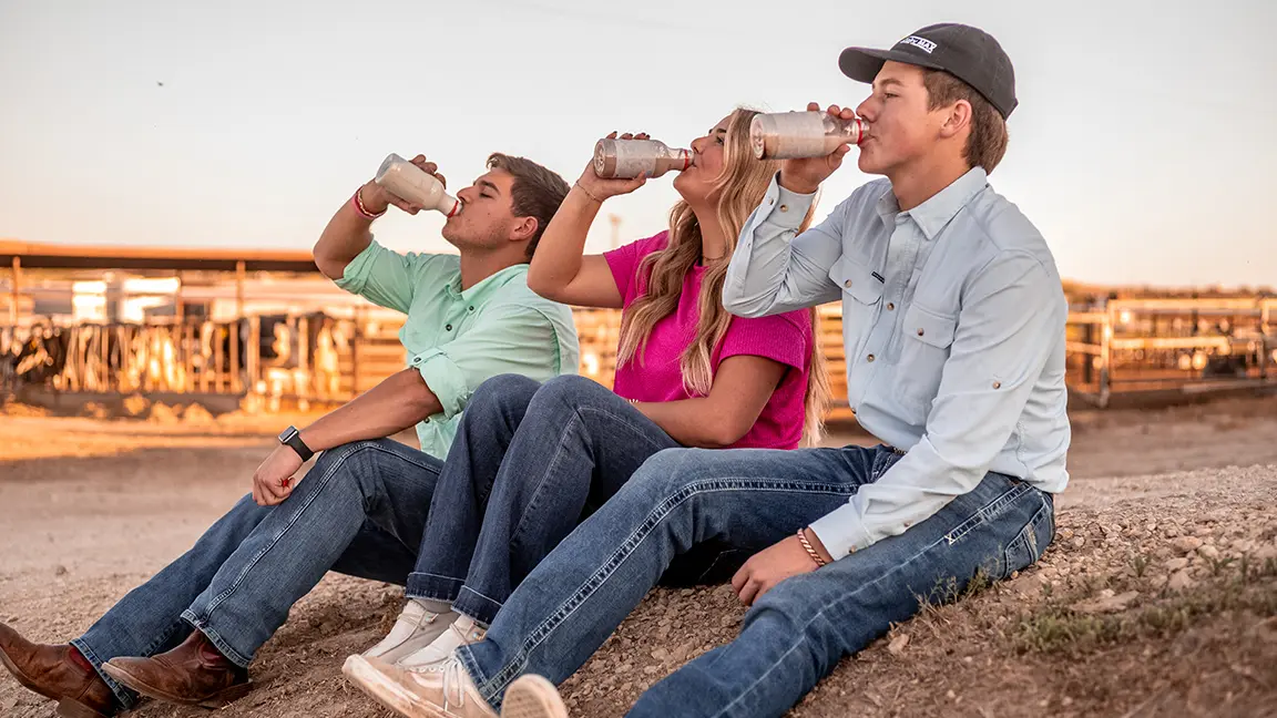 Jax, Tymrie and Jagger Collier knocking back some chocolate milk.